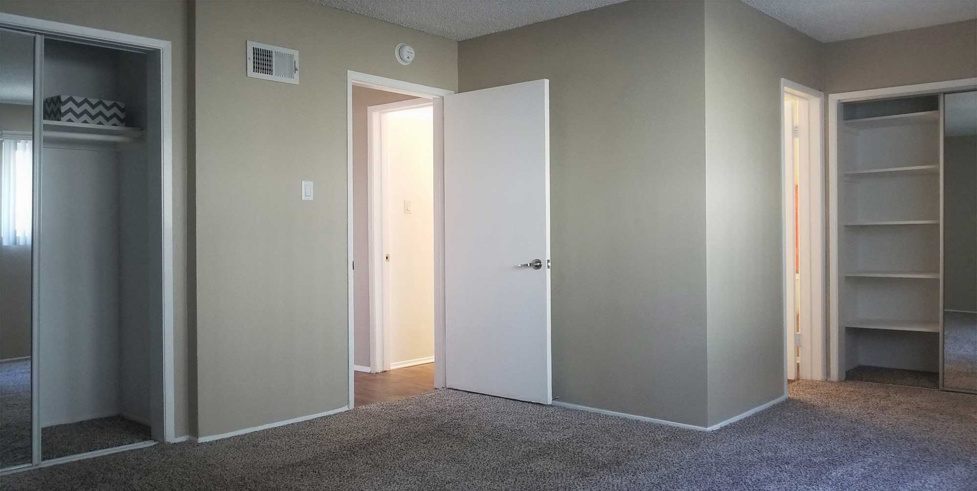 Interior bedroom and bathroom photo at Terraces Apartments